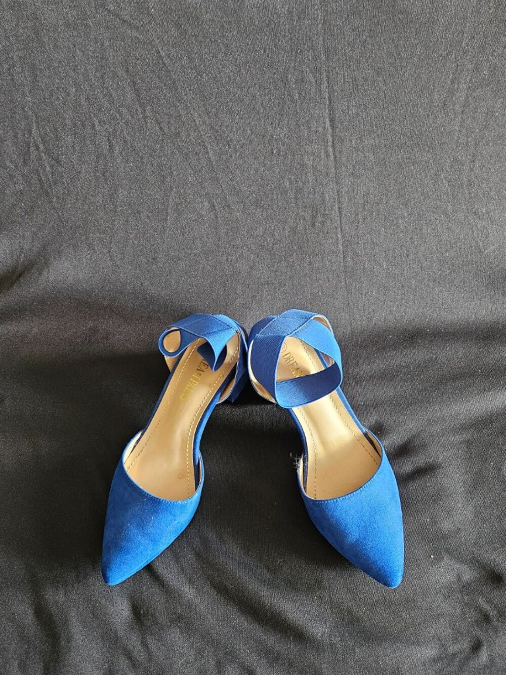 Pointy royal blue block heels with a stretchy ankle strap